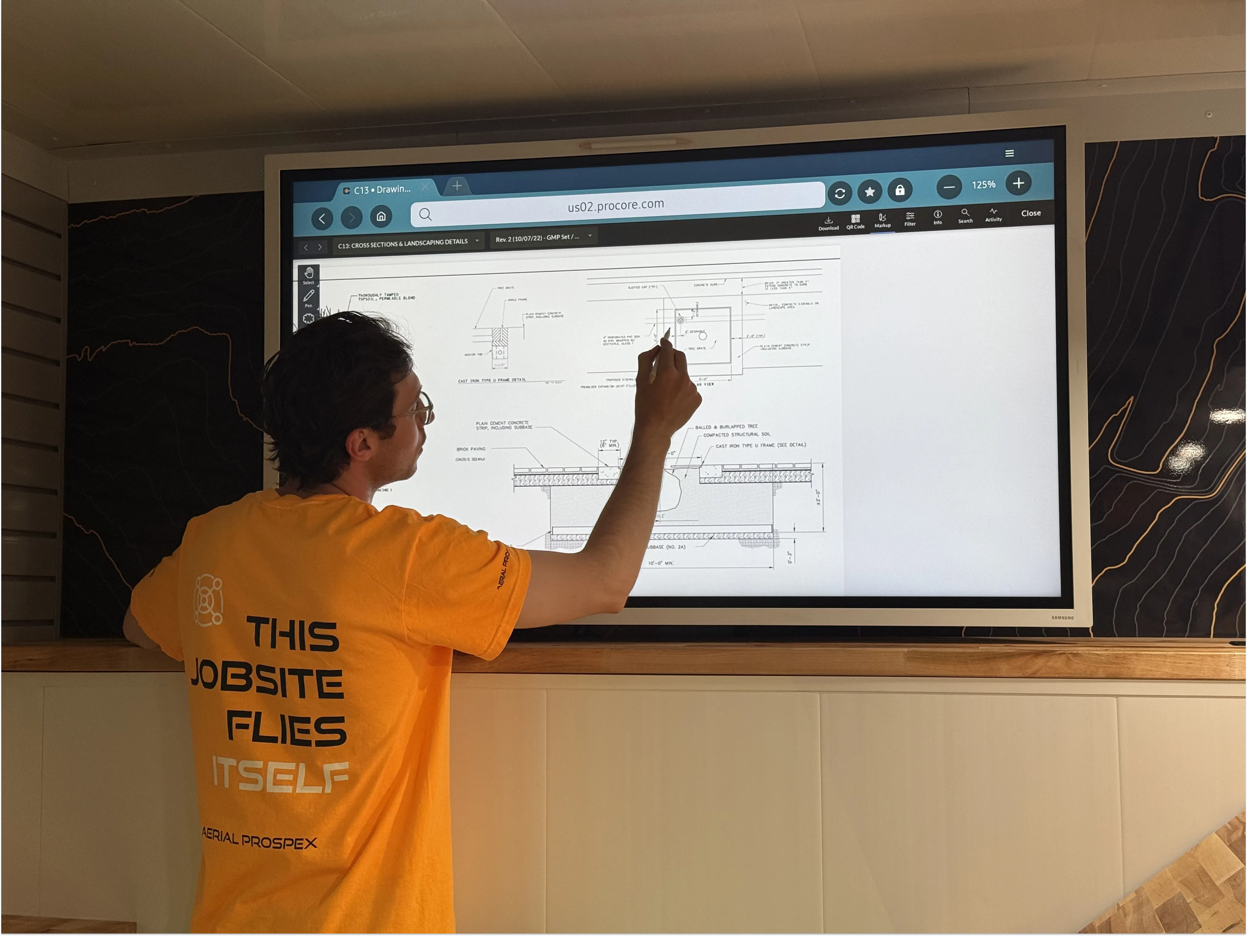 Mobile command center with technical drawings displayed on large screen